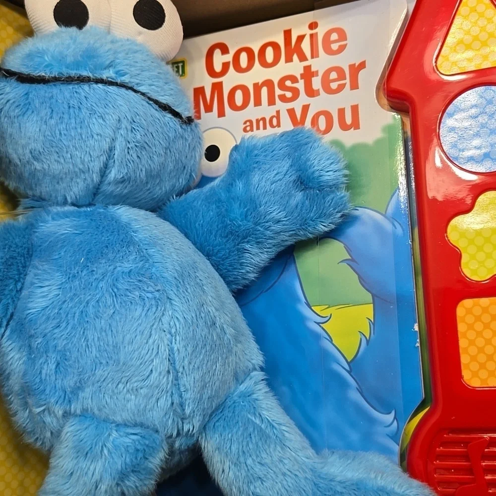 SING AND PLAY SONGBOOK AND CUDDLY COOKIE MONSTER. NEW IN BOX.
